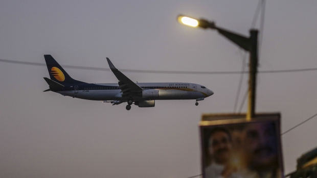 A Jet Airways India Ltd. plane prepares to land at Chhatrapati Shivaji International Airport in Mumbai, India, on Tuesday, Oct. 23, 2018. Jet Airways has approached banks for a moratorium on loans and has asked for fresh funds to ease a cash crunch, people with direct knowledge of the matter said, adding to signs the carriers troubles are deepening.
