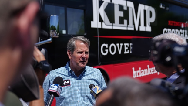 Brian Kemp talks to the media following a campaign event on May 17.