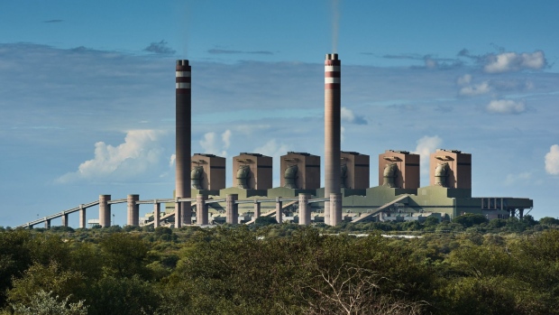 Vapour rises from chimneys at the Eskom Holdings SOC Ltd. Matimba coal-fired power station in Lephalale, South Africa, on Thursday, May 19, 2022. South Africa’s Eskom is increasing power cuts to prevent a total collapse of the grid as issues grow from lack of imports to breakdowns at its coal-fired plants.