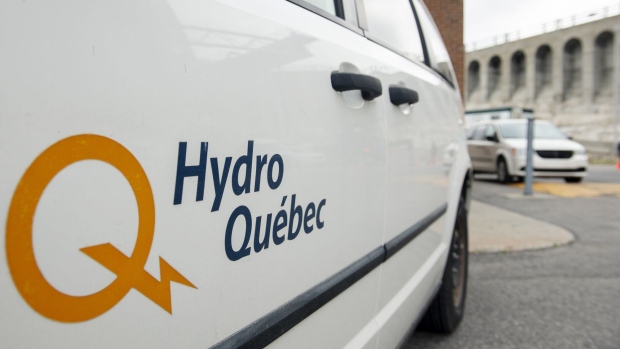 A Hydro-Quebec logo on a truck at the Beauharnois hydroelectric generating station on the Saint Lawrence River in Beauharnois, Quebec, Canada, on Thursday, Oct. 14, 2021. Hydro-Quebec has proposed construction of a 1.25 gigawatt transmission line from southern Quebec to Astoria, Queens, known as the Champlain Hudson Power Express, the Financial Post reports. Photographer: Graham Hughes/Bloomberg