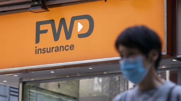 Signage atop an FWD Group Holdings Ltd. store in Hong Kong, China, on Tuesday, March 1, 2022. FWD Group, the Asian insurer backed by Hong Kong billionaire Richard Li, filed an application for an initial public offering in the city, after U.S.-China tensions scuppered more ambitious plans for an overseas debut. Photographer: Paul Yeung/Bloomberg