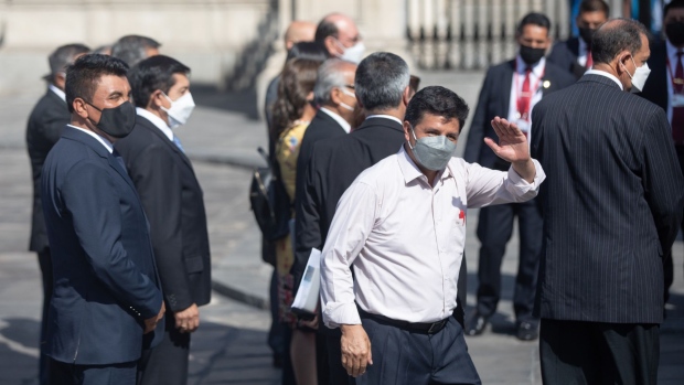 Pedro Castillo, Peru's president, greets attendees at the Government Palace in Lima, Peru, on Tuesday, March 8, 2022. Peru’s leftist president faces the second attempt to impeach him since he took office last July, while his government is also up against a vote of confidence in congress.