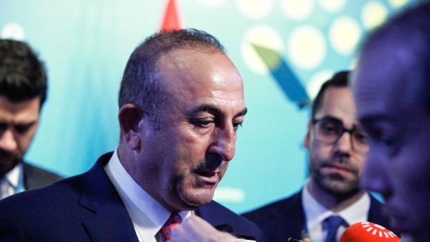 Mevlut Cavusoglu, Turkey's foreign affairs minister, speaks with members of the media before a press conference at the G-20 Leaders' Summit in Buenos Aires, Argentina, on Saturday, Dec. 1, 2018. Turkish President Recep Tayyip Erdogan said that the Saudi prosecutor who came to Turkey didn't share information and documents regarding the murder of Jamal Khashoggi