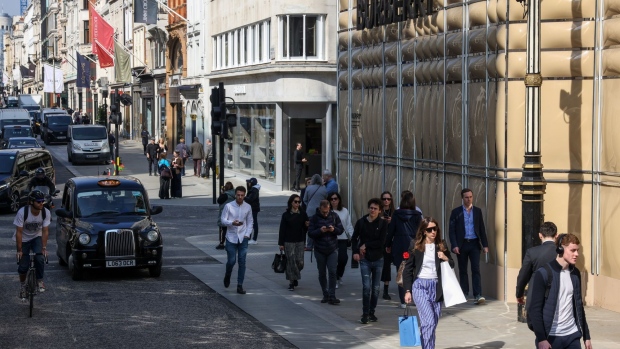 Shoppers and pedestrians pass the Burberry Group Plc story on New Bond Street in central London, U.K., on Thursday, March 24, 2022. The Office for National Statistics are due to release the latest U.K. retail sales figures on Friday.