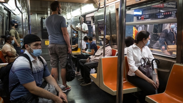 Commuters on a subway car in New York, U.S., on Friday, July 2, 2021. New York's Metropolitan Transportation Authority needs more riders to help support a record $51.5 billion capital plan to expand service throughout the New York City region and modernize its infrastructure.