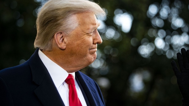 U.S. President Donald Trump smiles while speaking to members of the media before boarding Marine One on the South Lawn of the White House in Washington, D.C., U.S., on Wednesday, Jan. 20, 2021. Trump departs Washington with Americans more politically divided and more likely to be out of work than when he arrived, while awaiting trial for his second impeachment - an ignominious end to one of the most turbulent presidencies in American history.