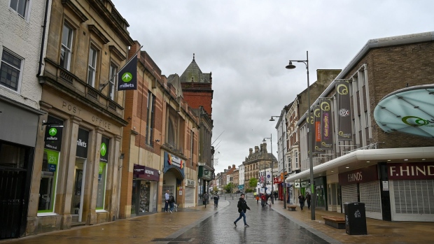 Pedestrians pass through a central square in the market town of Darlington, UK, on Friday, May 6, 2022. Darlington has emerged as the poster child for the government’s flagship plan to increase regional prosperity, but some locals are skeptical.