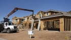 New homes under construction in Tucson, Arizona, U.S., on Tuesday, Feb. 22, 2022. Sales of new U.S. homes retreated in January after a flurry of purchases at the end of 2021, indicating a jump in mortgage rates may be starting to restrain demand.