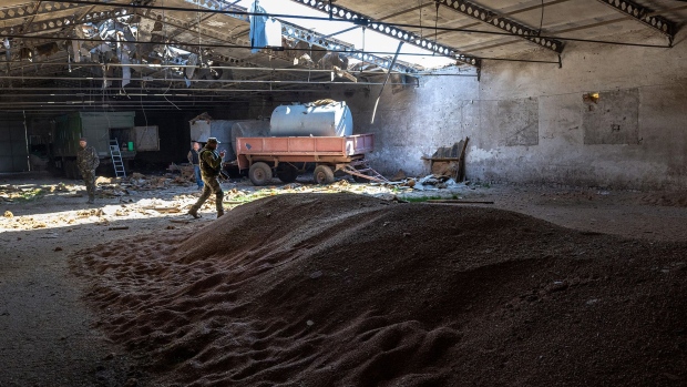  Ukrainian soldiers inspect a grain warehouse earlier shelled by Russian forces near the frontlines of Kherson Oblast in Novovorontsovka, Ukraine on May 6, 2022. 