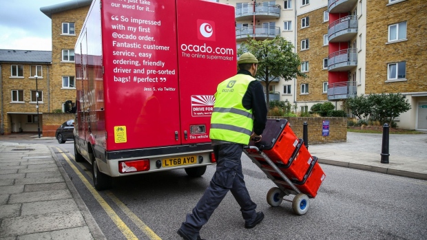 A driver for Ocado Group Plc delivers groceries in the Bow district of London, U.K., on Wednesday, Sept. 30, 2020. Covid-19 lockdown enabled online and app-based grocery delivery service providers to make inroads with customers they had previously struggled to recruit, according the Consumer Radar report by BloombergNEF.