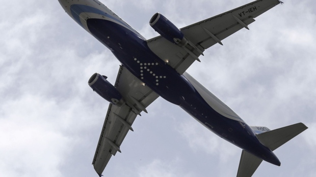 An aircraft operated by IndiGo, a unit of InterGlobe Aviation Ltd., prepares to land at Chhatrapati Shivaji International Airport in Mumbai, India, on Monday, July 10, 2017. IndiGo, the only carrier that has made a pitch to purchase Air India Ltd., sought to allay investor concerns about the budget operator buying the unprofitable national carrier, saying a deal would help speed up its plans for low-cost, long-distance flights.