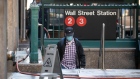 A pedestrian exits a Wall Street subway station near the New York Stock Exchange (NYSE) in New York, U.S., on Monday, Nov. 8, 2021. Nextdoor Inc., the free social-networking app aimed at connecting local neighborhoods, makes its stock-market debut Monday, capitalizing on its widening appeal during the pandemic.