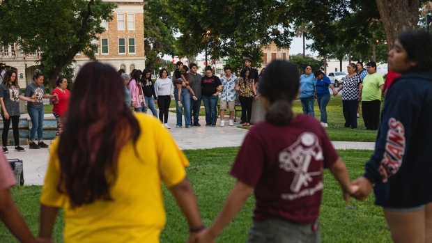 Members of the community gather at the City of Uvalde Town Square for a prayer vigil in the wake of a mass shooting at Robb Elementary School on May 24, 2022 in Uvalde, Texas.