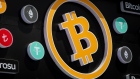 A bitcoin, center, and other cryptocurrency logo signs outside a cryptocurrency exchange kiosk in Istanbul, Turkey, on Tuesday, April 26, 2022. Both tech stocks and Bitcoin have notched big swings this year as the Federal Reserve becomes less accommodative as part of its fight to combat inflation.