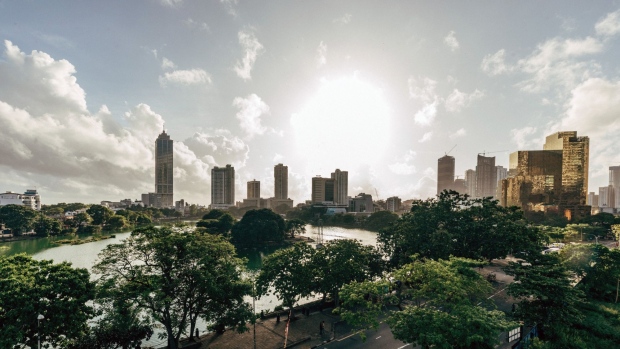 Buildings and the Beira Lake in Colombo, Sri Lanka, on Sunday, May 22, 2022. Sri Lanka’s dollar bonds due July rebound after Friday’s drop, up almost 5 cents on the dollar in the biggest gain since October, as the government holds bailout talks with the IMF.