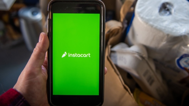 The Instacart logo on a smartphone arranged in Hastings-on-Hudson, New York, U.S., on Monday, Jan. 4, 2021. A booming market for U.S. initial public offerings shows no sign of slowing in 2021. Grocery-delivery company Instacart Inc. is preparing for a listing, according to people familiar with the matter. Photographer: Tiffany Hagler-Geard/Bloomberg