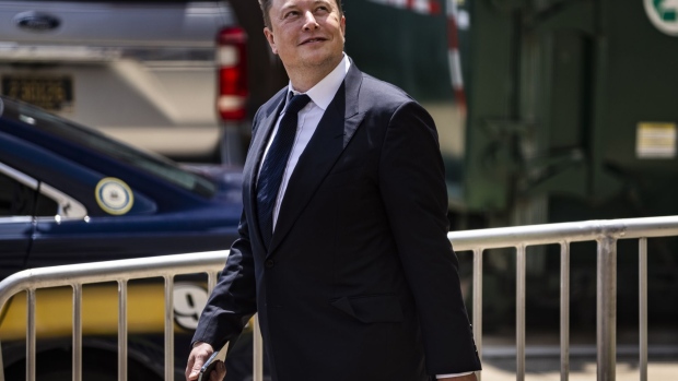 Elon Musk, chief executive officer of Tesla Inc., departs court during the SolarCity trial in Wilmington, Delaware, U.S., on Tuesday, July 13, 2021. Musk was cool but combative as he testified in a Delaware courtroom thatTesla's more than $2 billion acquisition of SolarCity in 2016 wasn't a bailout of the struggling solar provider.