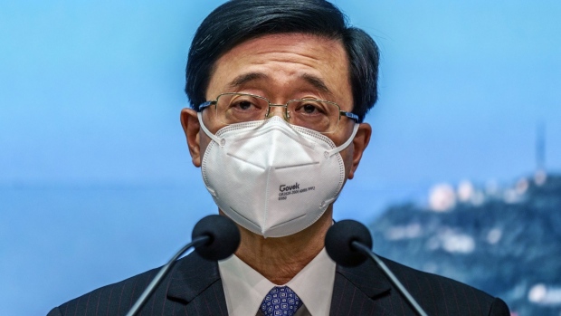 John Lee, Hong Kong's chief secretary, speaks during a news conference in Hong Kong, China, on Wednesday, April 6, 2022. Lee, Hong Kong's No. 2 official, said he will run for the city's top post if his resignation is accepted by China’s central government.