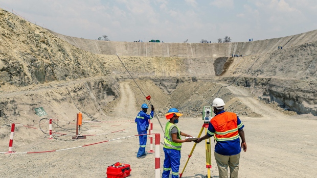 Workers survey the Portal One area of the Great Dyke Investments Ltd. Darwendale platinum mine project, near Harare, Zimbabwe, on Wednesday, Sept. 16, 2020. The so-called Darwendale project, which lies 65 kilometers (40 miles) from the capital Harare, is central to the Zimbabwean government’s plans to revive its stagnant economy. Photographer: Godfrey Marawanyika/Bloomberg