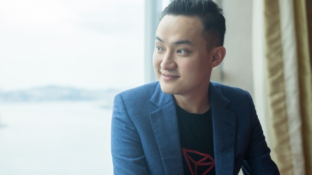 Justin Sun, chief executive officer and founder of Tron Foundation, poses for a photograph in Hong Kong, China, on Tuesday, June 4, 2019. Cryptocurrency pioneer Justin Sun bid a record $4.57 million to have lunch with Warren Buffett, who famously referred to Bitcoin as "probably rat poison squared."