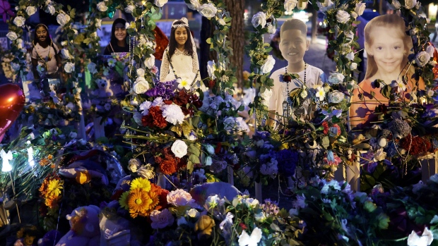 Flowers and photographs are seen at a memorial dedicated to the victims of the mass shooting at Robb Elementary School on June 2, 2022 in Uvalde, Texas. 