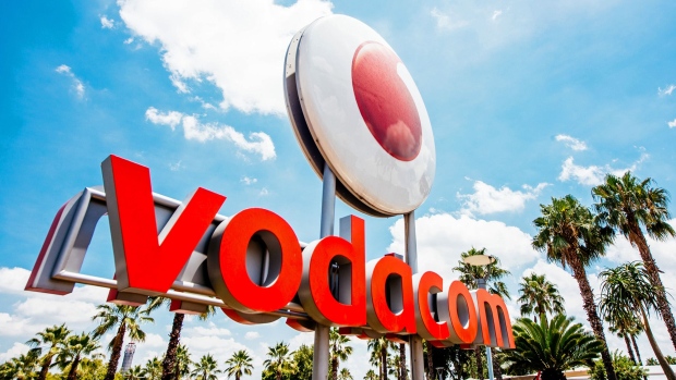 A logo sits on display outside the headquarters of Vodacom Group Ltd. in Johannesburg, South Africa. Photographer: Dean Hutton