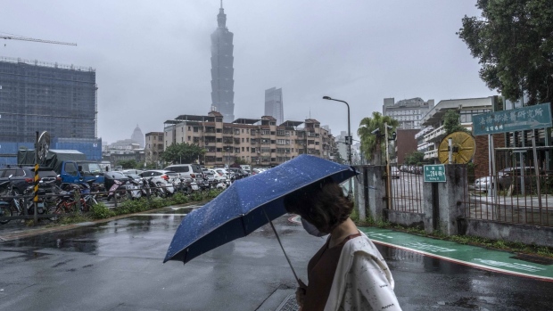 A pedestrian passes the Taipei 101 building in Taipei, Taiwan, on Tuesday, May 24, 2022. US President Joe Biden is seeking to show US resolve against China, yet an ill-timed gaffe on Taiwan risks undermining his bid to curb Beijing’s growing influence over the region. Photographer: Lam Yik Fei/Bloomberg