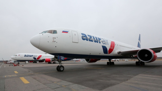 Two passenger jets operated by Azur Air stand on the tarmac at Domodedovo Airport ZAO in Domodedovo, Russia.