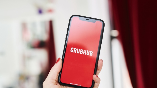 The logo for the Grubhub Inc. application is displayed on an Apple Inc. iPhone in an arranged photograph taken in the Brooklyn borough of New York, U.S., on Friday, April 10, 2020. Grubhub, the parent of food delivery app Seamless, said last month it was deferring fees for independent restaurants using the service in response to the coronavirus pandemic. Photographer: Gabby Jones/Bloomberg