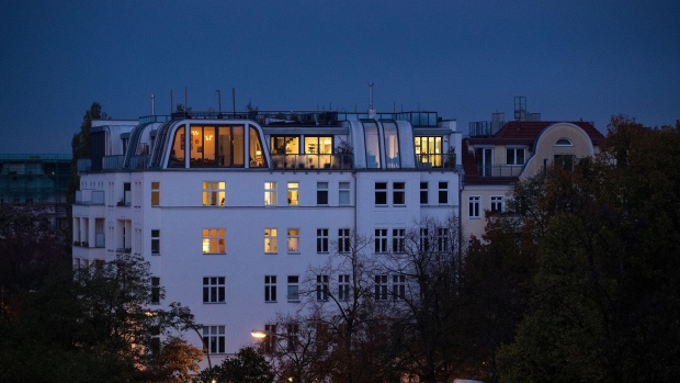 Lights illuminate residential apartments in the Prenzlauer Berg district of Berlin, Germany, on Wednesday, Oct. 23, 2019. Berlin’s governing parties struck a deal to freeze rents for five years, marking one of the most radical plans to tackle spiraling housing costs in a major city and hitting the shares of major apartment owners.