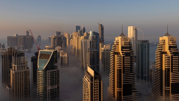 Morning fog shrouds residential and commercial skyscrapers in the Dubai Marina district of Dubai, United Arab Emirates, on Jan. 17, 2021.