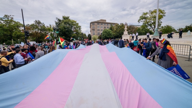 WASHINGTON DC, UNITED STATES - 2019/10/08: A giant Trans Flag unfurled outside the Supreme Court. 133 protesters were arrested blocking the street across the Supreme Court in an act of non violent civil disobedience, as hundreds of LGBTQ+ advocates convened in Washington, DC for a national day of action as a community response to the landmark Supreme Court hearings that could legalize workplace discrimination, primarily against LGBTQ+ people, on the basis of sexual orientation, gender identity, and gender presentation. (Photo by Erik McGregor/LightRocket via Getty Images) 