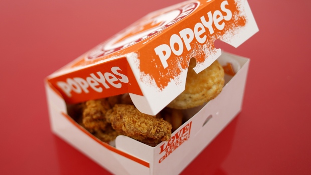 A box of fried chicken and biscuits is arranged for a photograph outside a Popeyes fast food restaurant in Jeffersonville, Indiana. Photographer: Luke Sharrett/Bloomberg