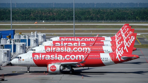 Airbus A330 aircraft operated by AirAsia at Kuala Lumpur International Airport 2 (KLIA 2) in Sepang, Selangor, Malaysia, on Friday, April 1, 2022. Malaysia allows quarantine-free entry for fully vaccinated travelers from April 1, ending almost two years of stringent border controls introduced to contain the Covid-19 outbreak.
