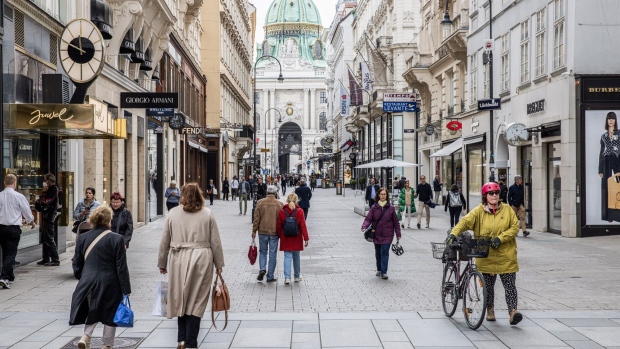 Pedestrians walk down the Kohlmarkt shopping street in Vienna, Austria, on Thursday, May 20, 2021. Western Europe is beginning to loosen restrictions to contain the coronavirus, offering relief for the pandemic-weary region as vaccination programs turn the corner.
