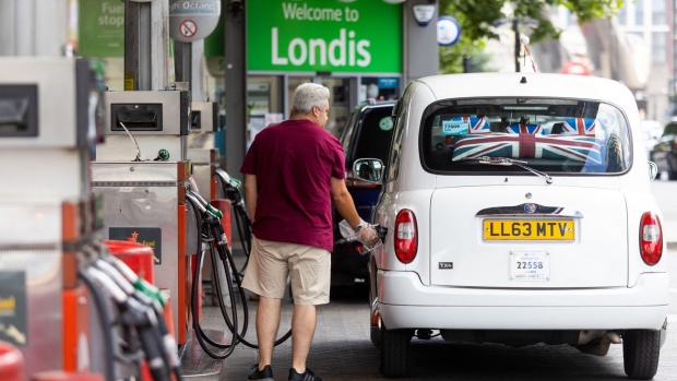 A customer fills their taxi at a Texaco Inc. petrol station in London, UK, on Monday, June 13, 2022. Last week, UK fuel prices surged by the most in 17 years to underscore the inflationary pressures the country faces.