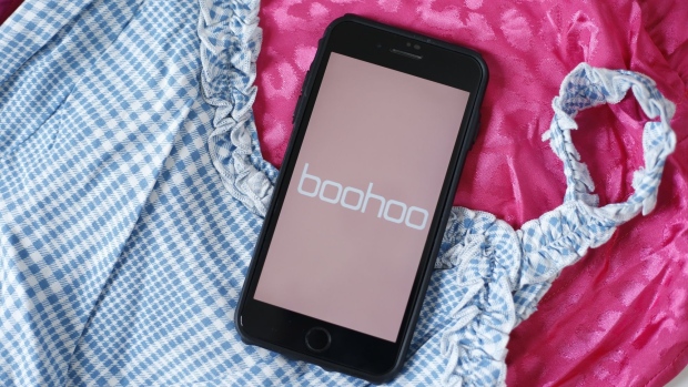 The Boohoo Group Plc logo is displayed on an Apple Inc. iPhone in this arranged photograph in London, U.K., on Thursday, July 16, 2020. Shares of Boohoo slumped this month after reports about conditions at suppliers in Leicester, England led U.K. regulators to investigate.