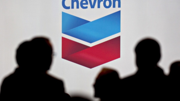The Chevron Corp. logo is displayed at a gas station in Dallas, Texas, U.S., on Wednesday, July. 26, 2017. Chevron Corp. is scheduled to release earnings figures on July 28. Photographer: Bloomberg/Bloomberg