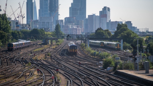 Passenger trains arrive at Clapham Junction railway station in London, UK, on Tuesday, June 14, 2022. Rail and underground strikes due to hit the UK for three days later this month could cost the economy almost 100 million pounds ($125 million), with London dealt the biggest blow.