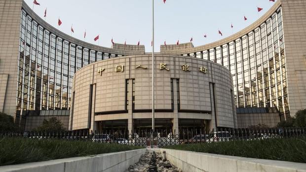 The People's Bank of China headquarters stand in Beijing, China, on Monday, Oct. 23, 2017. China's central bank is said to have gauged demand for 63-day reverse repurchase agreements for the first time ever. Photographer: Qilai Shen/Bloomberg
