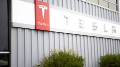 Tesla Inc. signage is displayed outside the company's factory in Fremont, California, U.S., on Monday, July 20, 2020. Tesla Inc. is scheduled to release earnings figures on July 22. Photographer: Nina Riggio/Bloomberg