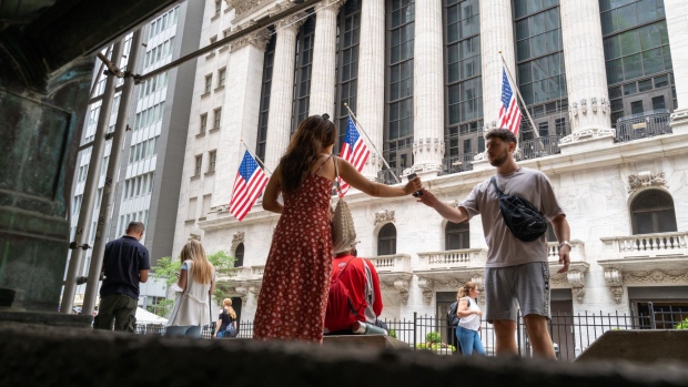 NEW YORK, NEW YORK - JUNE 14: People walk outside of the New York Stock Exchange (NYSE) in the financial district in Manhattan on June 14, 2022 in New York City. The Dow was up in morning trading following a drop on Monday of over 800 points, which sent the market into bear territory as fears of a possible recession loom. (Photo By Spencer Platt/Getty Images)