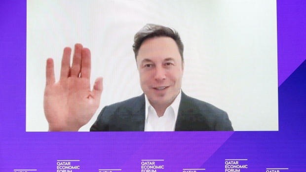Elon Musk, chief executive officer of Tesla Inc., appears via video link during the Qatar Economic Forum in Doha, Qatar, on Tuesday, June 21, 2022. The second annual Qatar Economic Forum convenes global business leaders and heads of state to tackle some of the world's most pressing challenges, through the lens of the Middle East.