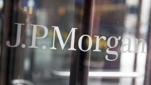 The JPMorgan Chase & Co. logo on a door. Photographer: ANDREW HARRER