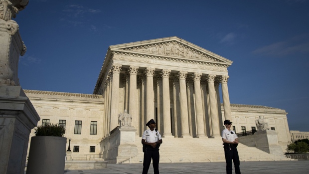Police officers outside the U.S. Supreme Court in Washington, D.C. Photographer: Al Drago/Bloomberg