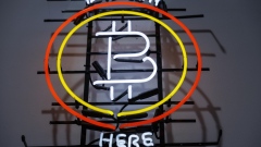 A neon sign indicates that Bitcoin is available inside an Alza.cz store in Prague, Czech Republic, on Tuesday, May 17, 2022. Crypto companies have started to plan for a potential protracted market slowdown. Photographer: Milan Jaros/Bloomberg