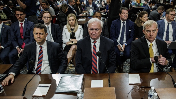 Steven Engel, former assistant US attorney general for the office of legal counsel, from left, Jeffrey Rosen, former acting US attorney general, and Richard Donoghue, former acting deputy US attorney general, during a hearing of the Select Committee to Investigate the January 6th Attack on the US Capitol in Washington, D.C., US, on Thursday, June 23, 2022. The House committee investigating the 2021 insurrection at the US Capitol is focusing on Donald Trump's attempts to pressure top Justice Department officials to bolster his claims of election fraud in battleground states that Joe Biden won.