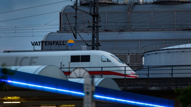 An Intercity Express (ICE) passenger train passes the Mitte Combined Heat and Power (CHP) natural gas power plant, operated by Vattenfall AB, in Berlin, Germany, on Tuesday, May 17, 2022. The European Union is set to unveil a raft of measures ranging from boosting renewables and LNG imports to lowering energy demand in its quest to cut dependence on Russian supplies which accounted for about 40% of the bloc’s gas demand.