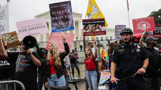 Demonstrators outside the US Supreme Court in Washington, D.C., on June 23. Photographer: Valerie Plesch/Bloomberg