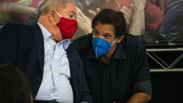 Luiz Inacio Lula da Silva, Brazil's former president, speaks with Fernando Haddad, former mayor of Sao Paulo, right, during a news conference at the Labor Union in Sao Bernardo do Campo, Brazil, on Wednesday, March 10, 2021. Lula was thrust back into Brazil's political scene after a judge tossed out criminal convictions against the leftist icon, adding to the angst that has already prompted investors to dump the country's assets.